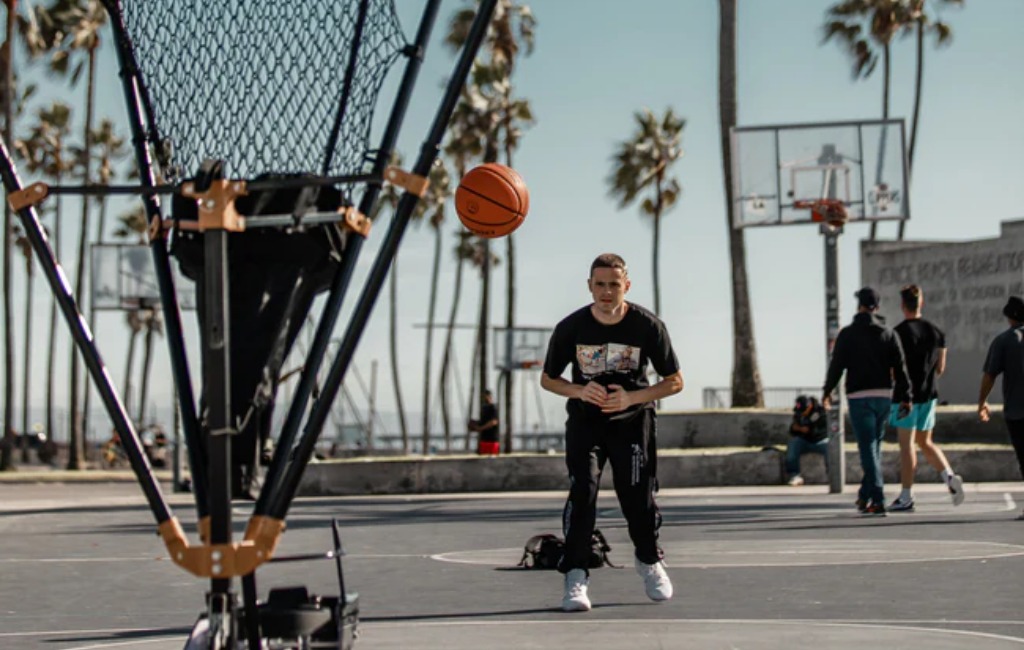 kids playing with grind basketball shooting machine