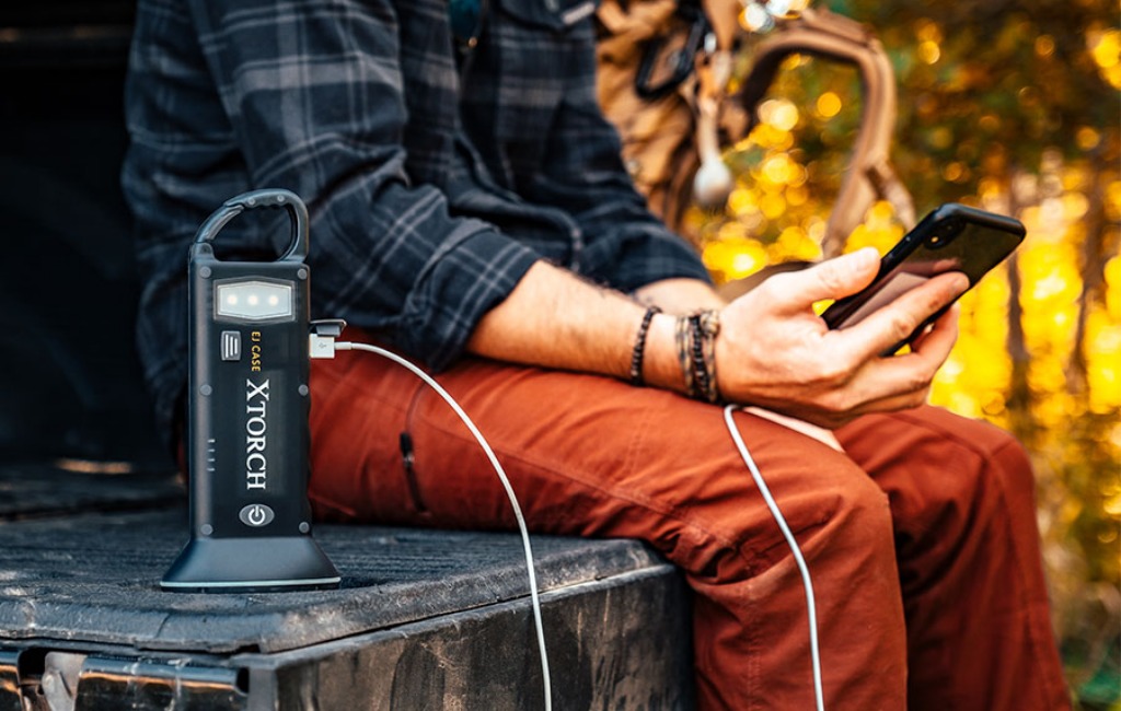 charging phone with xtorch solar-powered flashlight