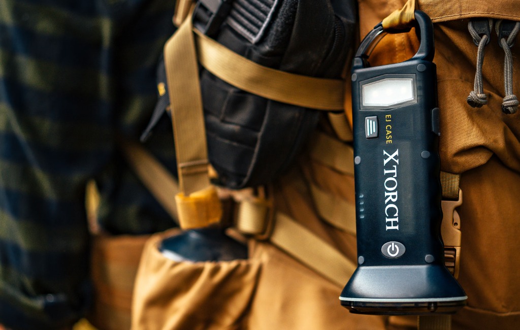 carrying xtorch solar-powered flashlight on backpack