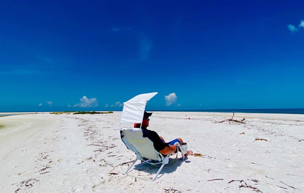 man sitting on beach