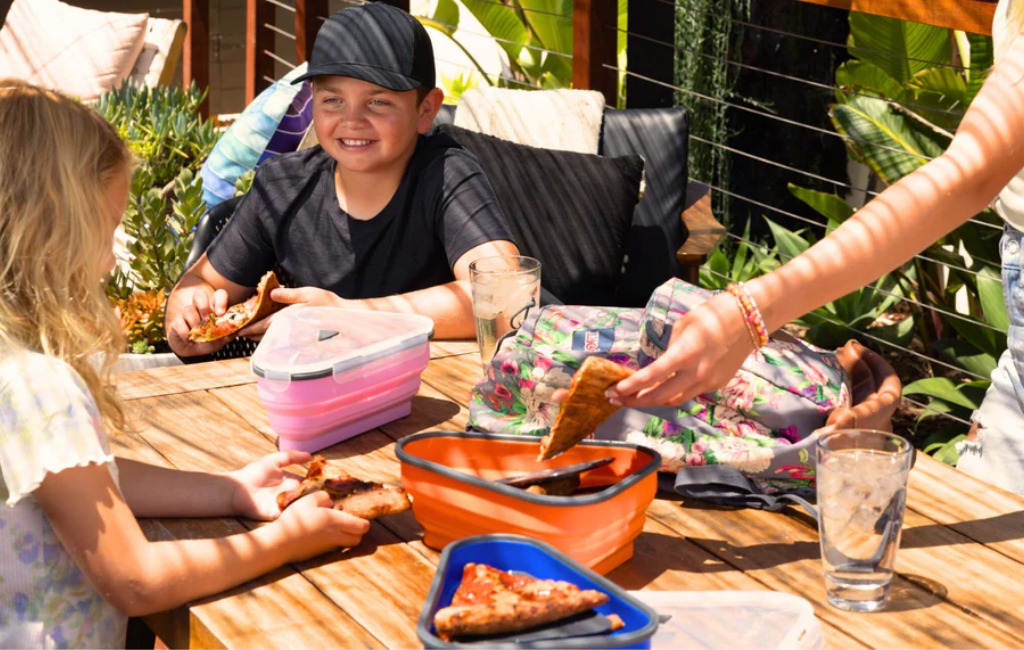 a family getting pizza slices on pizza pack