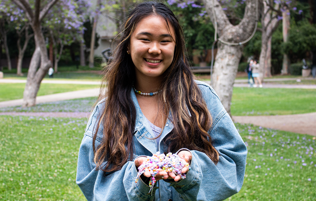 a girl playing with sliimeyhoney