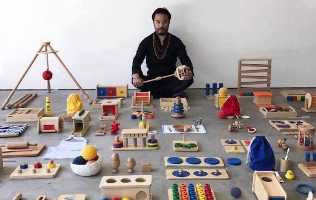 man with Montessori toys