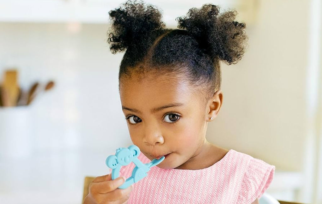 a girl using the baby toon silicone baby spoon