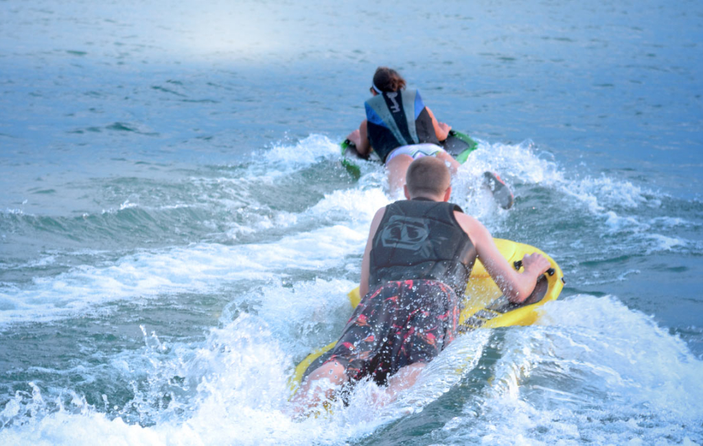 man and woman on boards