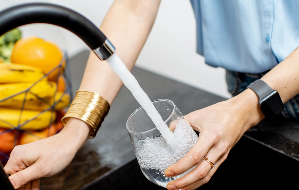 filling glass with tap water