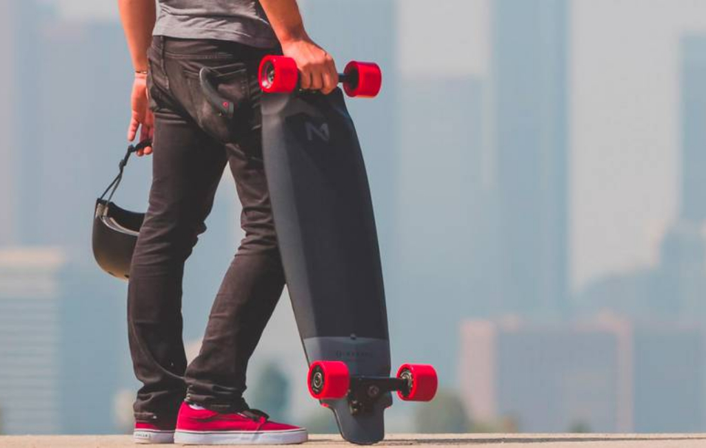 man holding skateboard