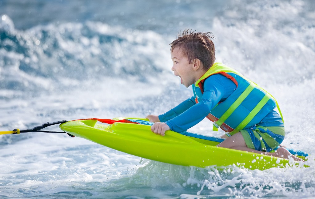 a-kid-using-zup-watersports-board-on-water