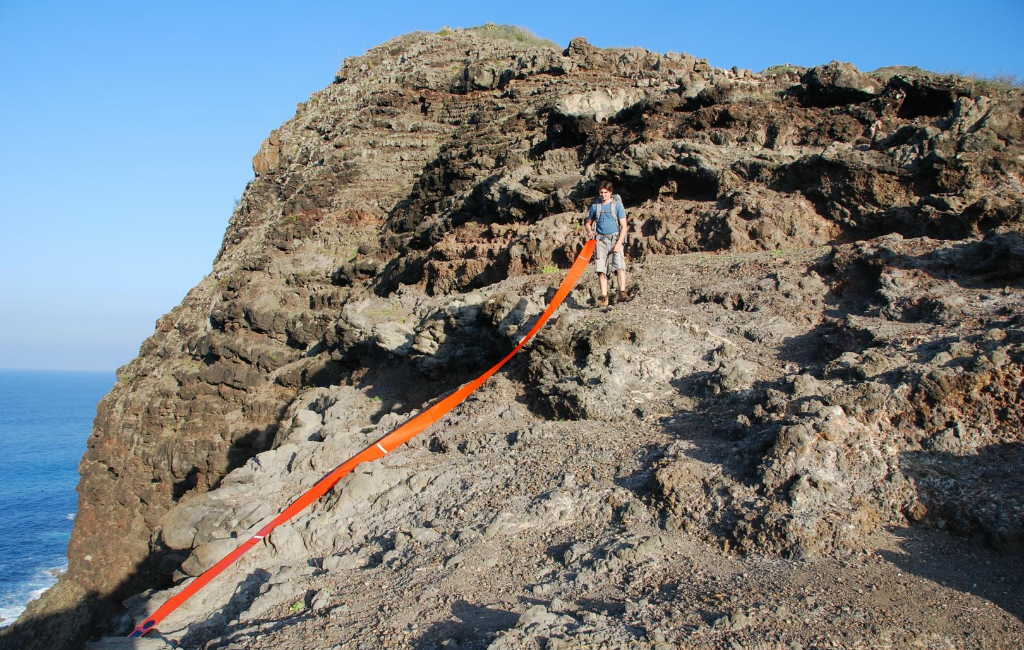 man-walking-sea-mountain