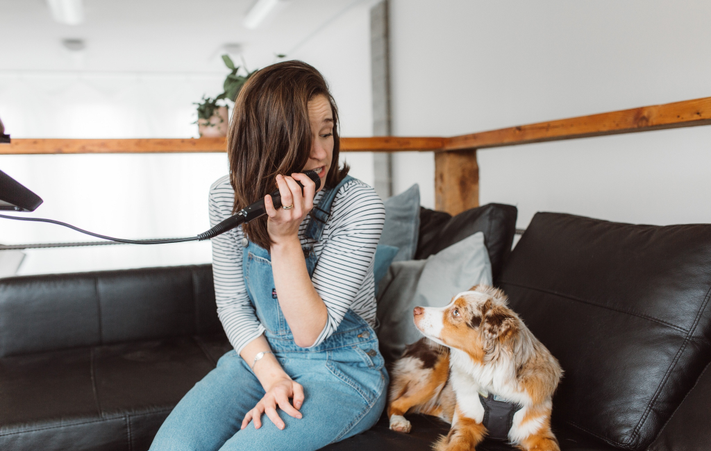 woman singing for dog