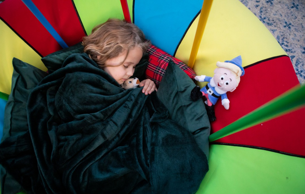 sleeping girl with toys