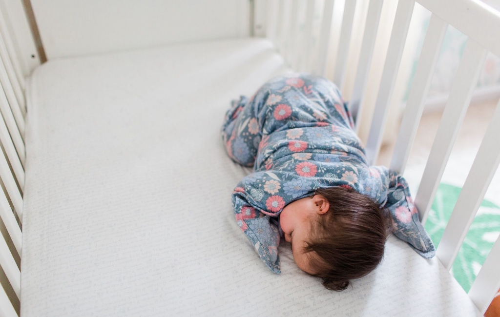 baby sleeping in bed