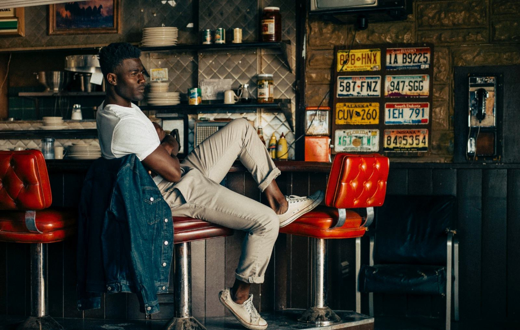 man sitting in the bar