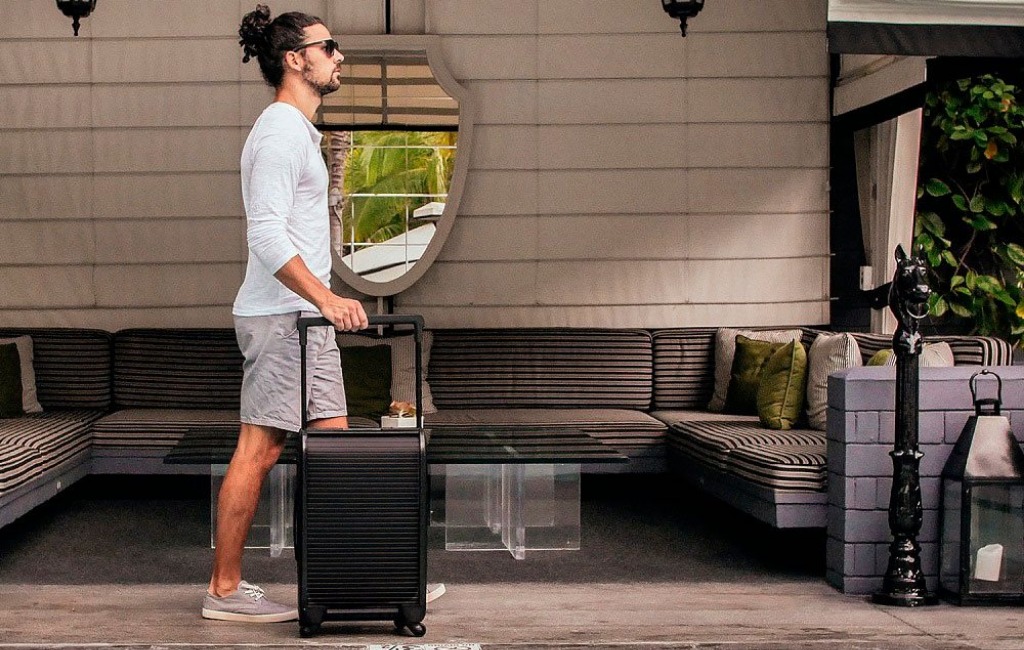 a-man-holding-trunkster-luggage