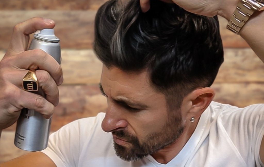 man-holding-pete-&-pedro-men’s-hair-styling-products