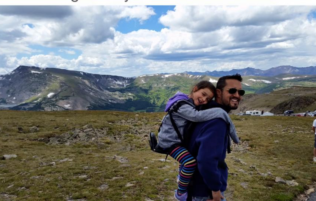 father and baby on mountain