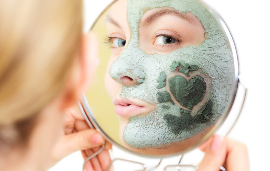 woman-applying-face-mask