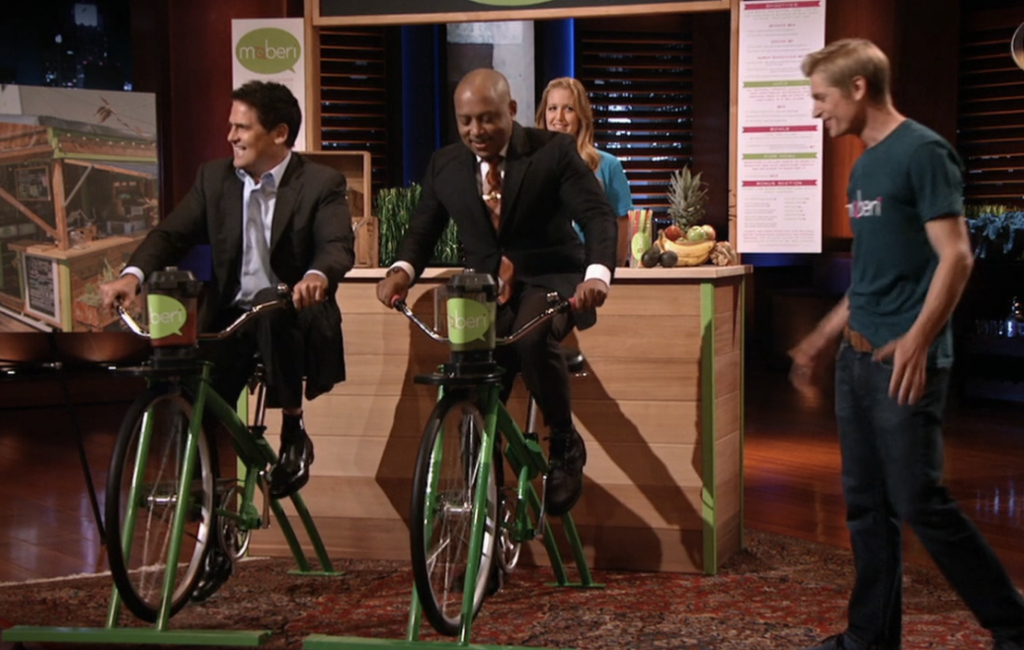 Mark and Daymond driving bikes