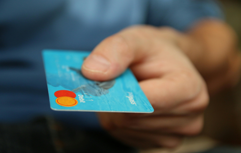 person-holding-debit-card